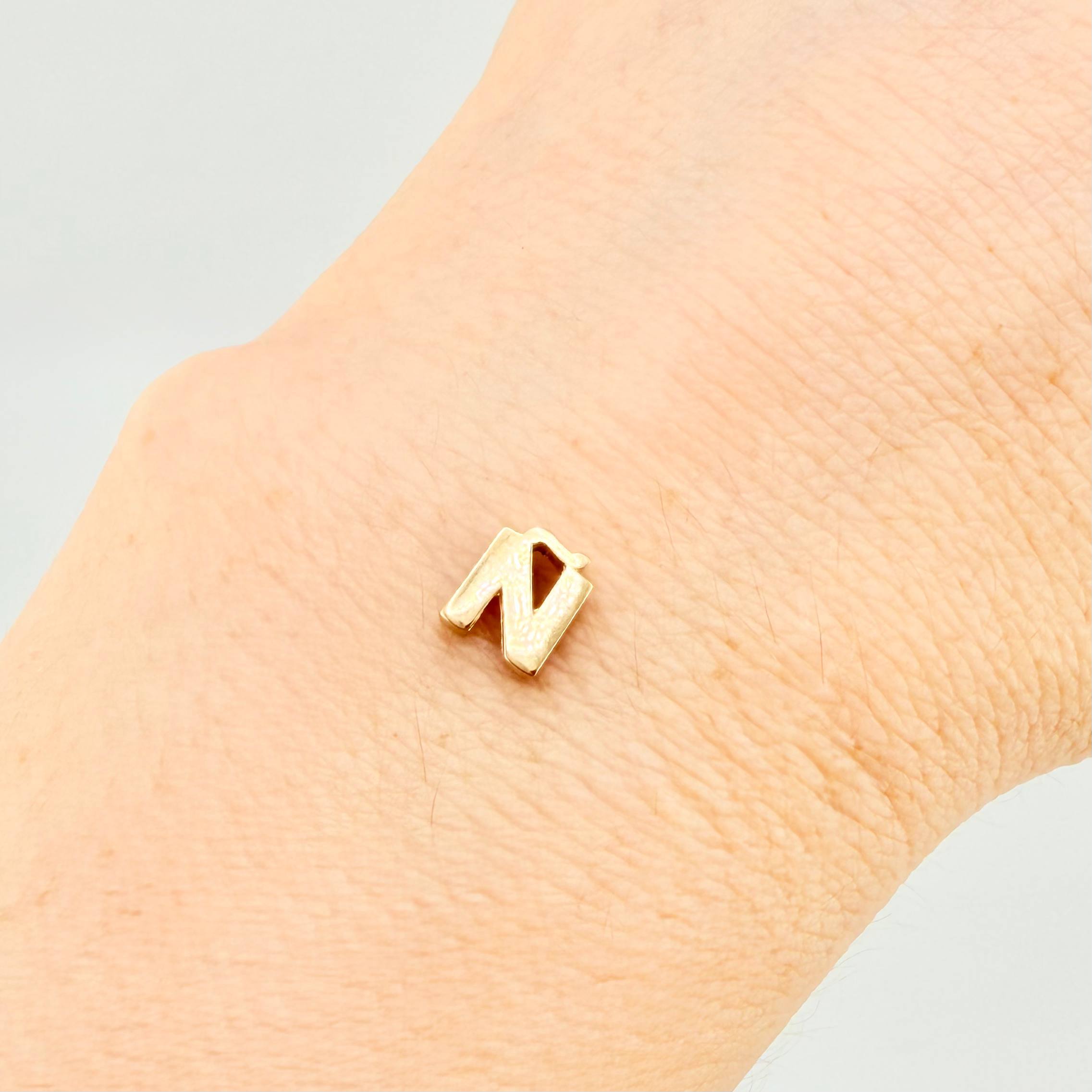 Herraje Tambor Letra Ñ 0.55gr / 7mm Oro Amarillo 18K
