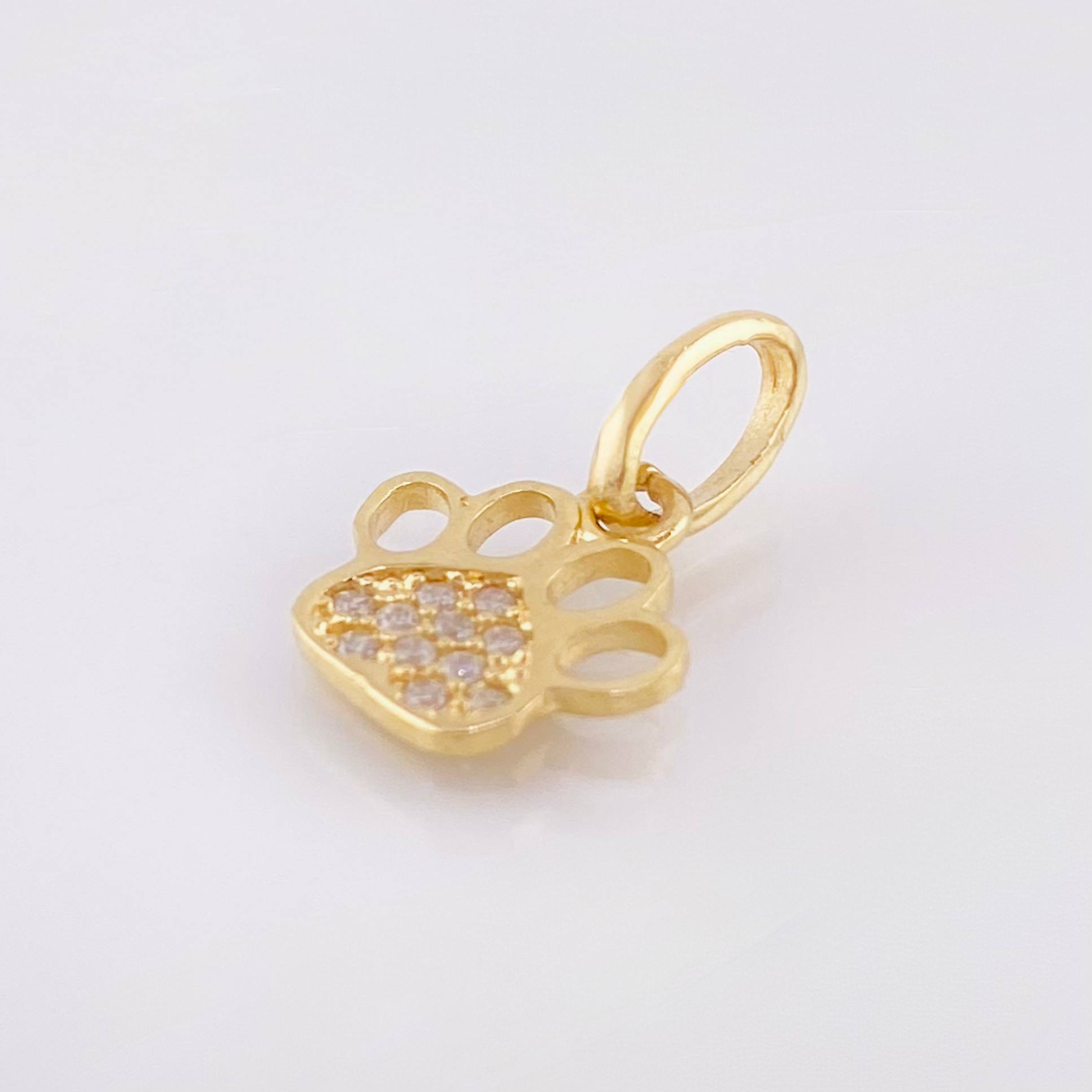 Dije Huella 0.65gr / 1/2 in / Oro Amarillo 18K