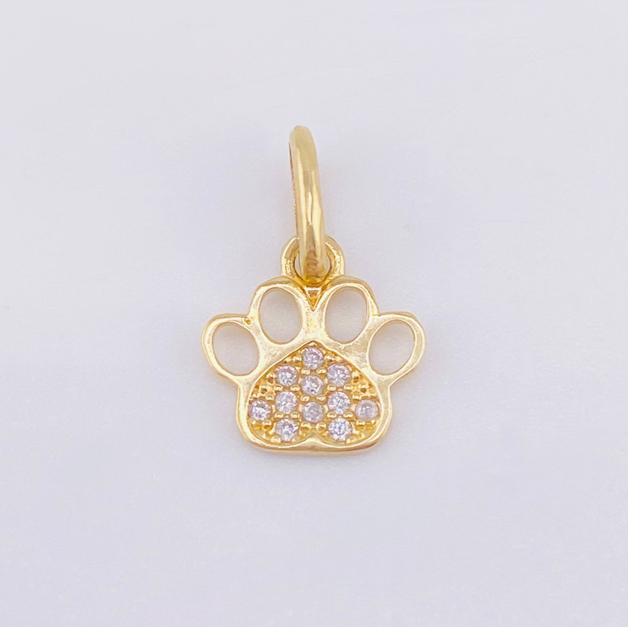 Dije Huella 0.65gr / 1/2 in / Oro Amarillo 18K