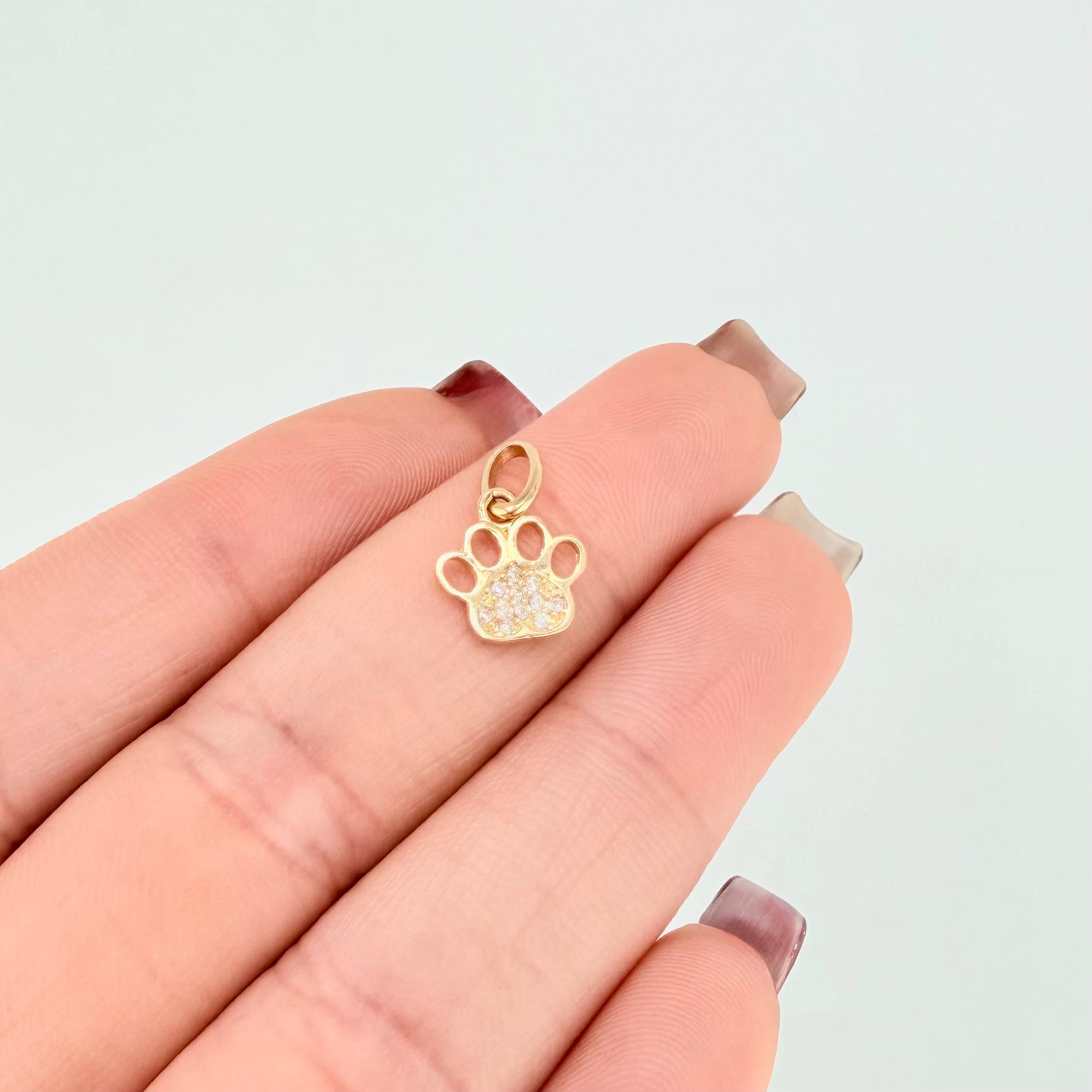 Dije Huella 0.65gr / 1/2 in / Oro Amarillo 18K