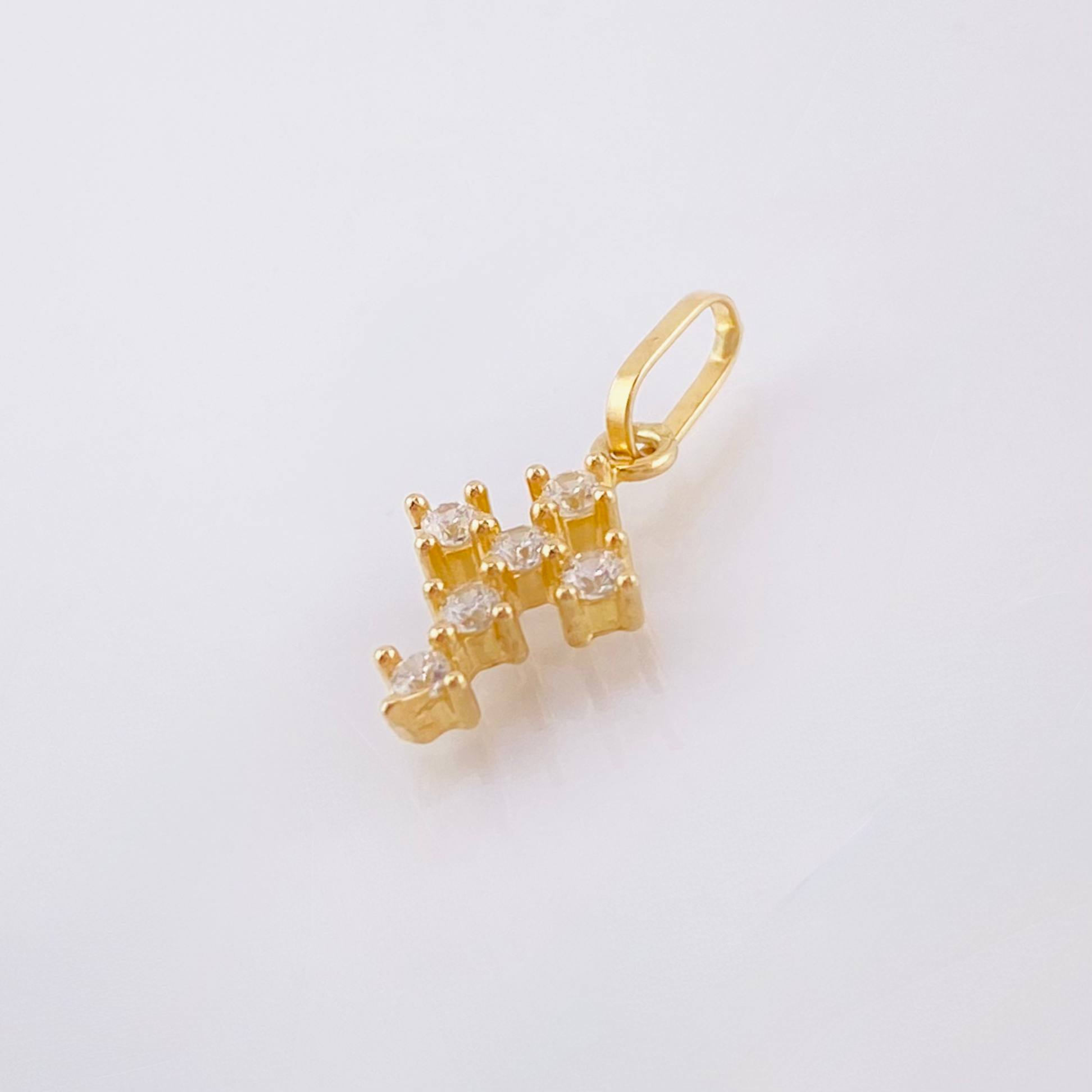 Dije Cruz Tupida 0.45gr / 1/2 in / Oro Amarillo 18K