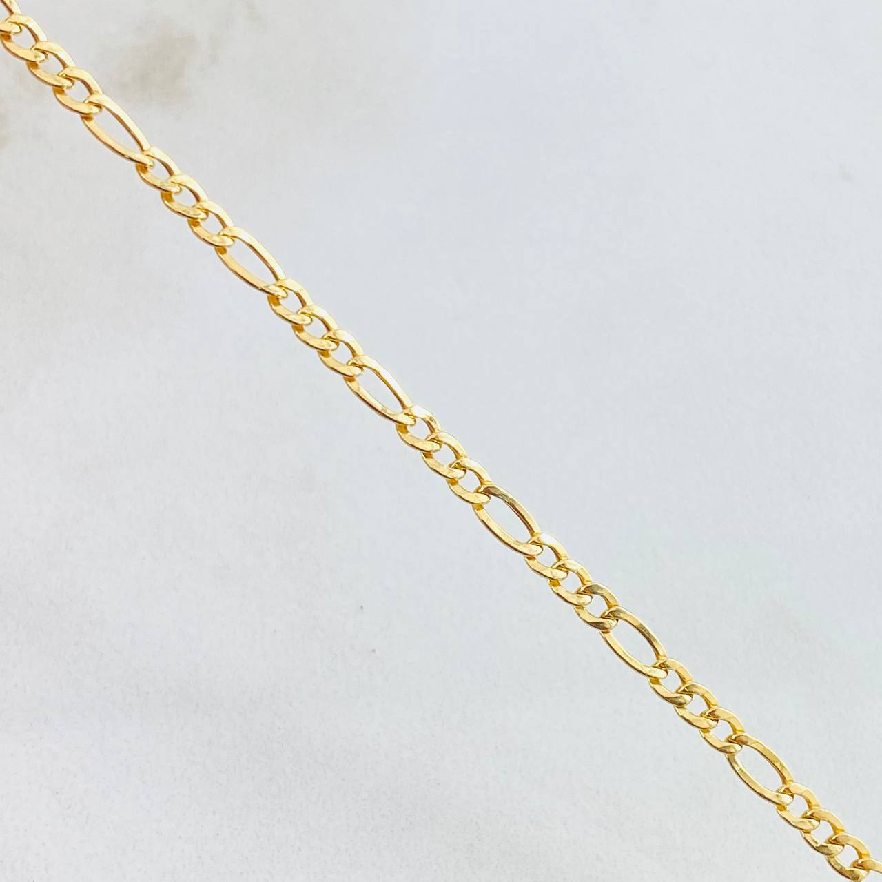 Figaro Bracelet 1gr / 7 1/2 in / 2.5mm Yellow Gold +1 18K