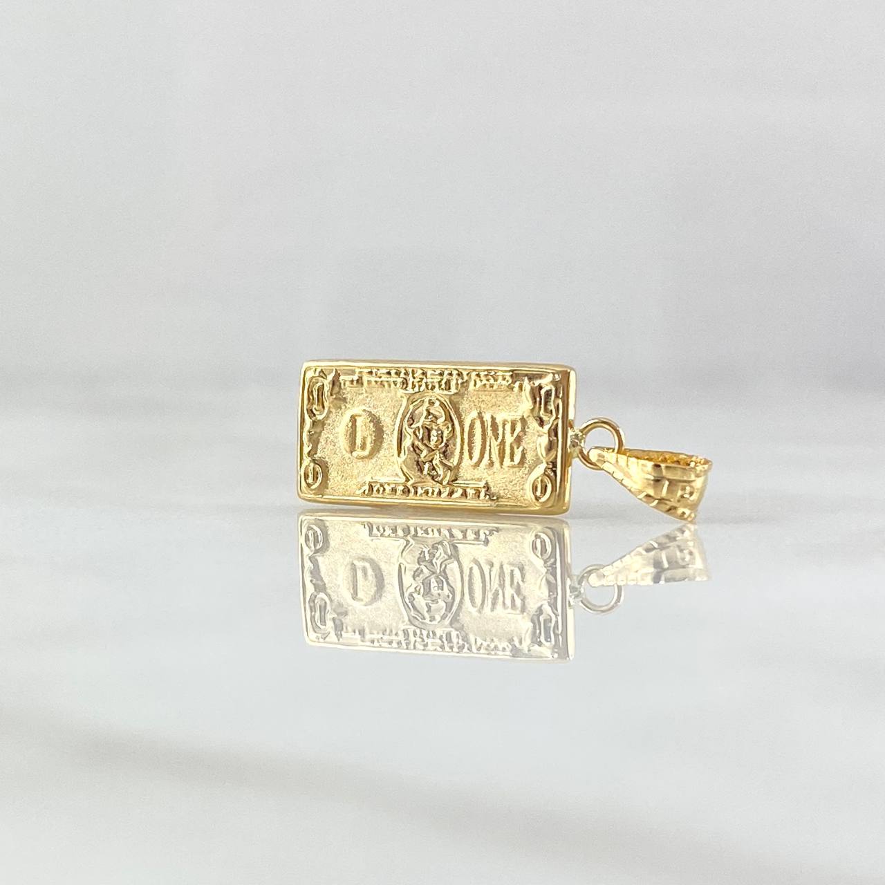 Dije Dólar 0.6gr / 2cm / Oro Amarillo 18K ©
