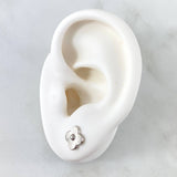 Topos Flor Rayada 0.95gr / 8mm Oro Blanco 18K