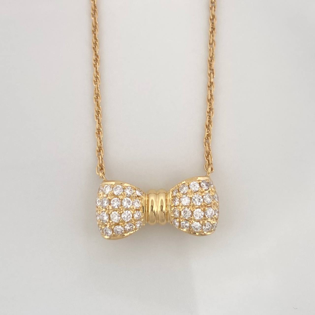 Cadena Singapur Moño Diamantes 40pts 5g / 16 in / 1.24mm Oro Amarillo 18K