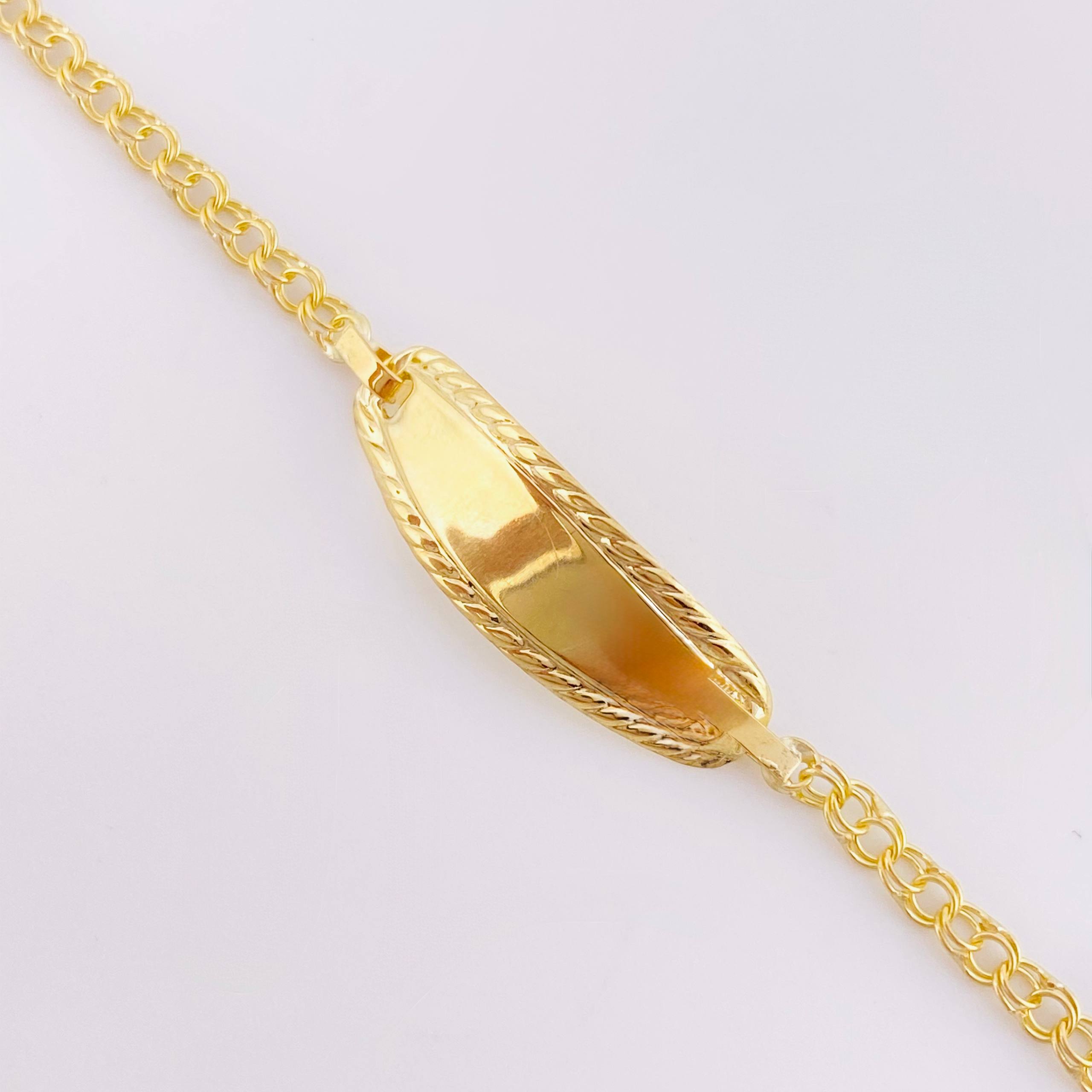 Pulso Bebé Roll On Placa Ovalada Relieve 1.35gr / 5 3/4 in / 2.3mm Oro Amarillo 18K