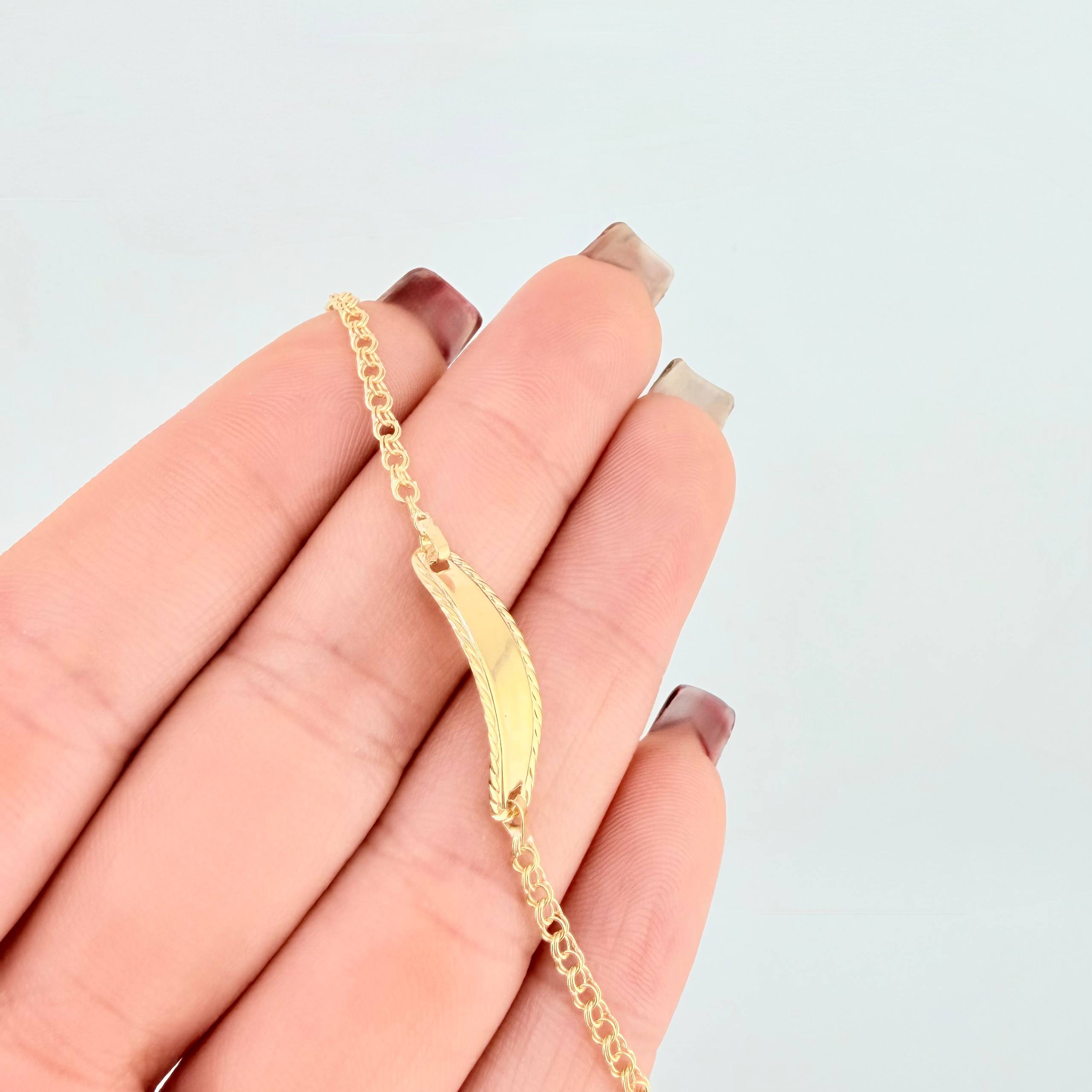 Pulso Bebé Roll On Placa Ovalada Relieve 1.35gr / 5 3/4 in / 2.3mm Oro Amarillo 18K