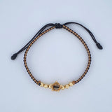 Pulsera Tejida Negra Beige Corona 2.15gr / Oro 18K $