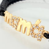 Pulsera Tejida Negra Mamá Oro Amarillo 18K