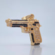 Dije Pistola 11.9gr / 3.5cm / Circones Negros Blancos Dos Oros Negro Amarillo 18K $