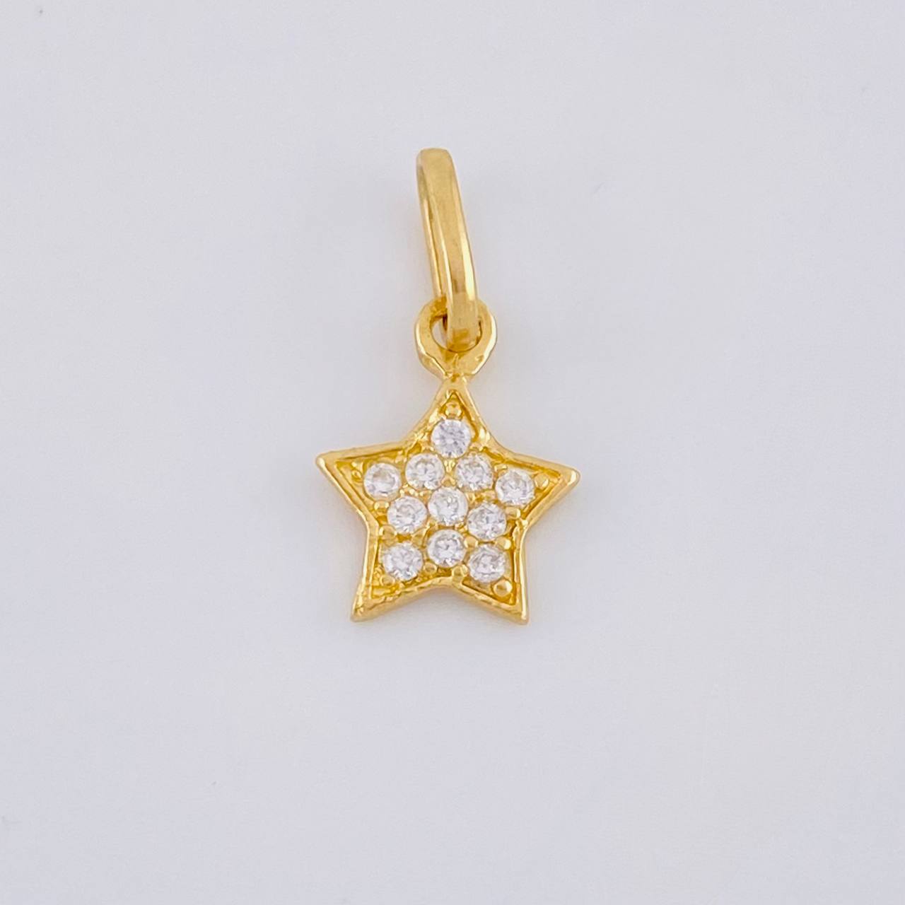 Dije Estrella 0.55 g / 1/2 in Oro Amarillo 18K