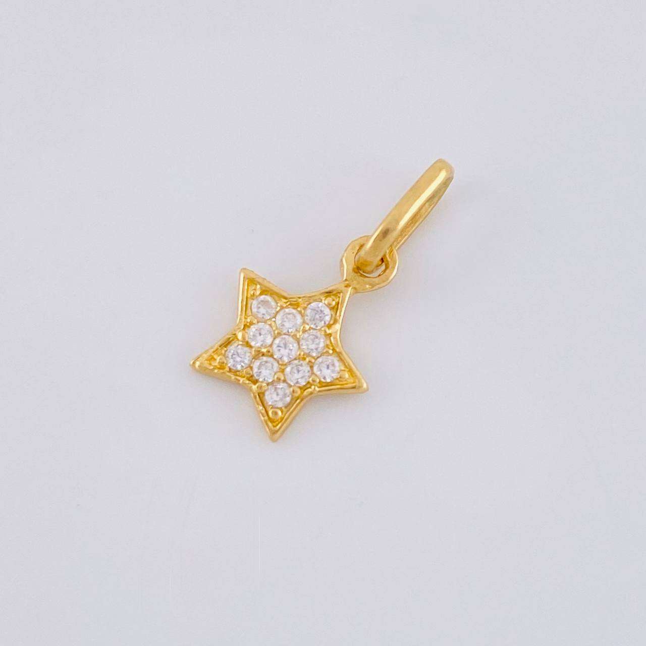 Dije Estrella 0.55 g / 1/2 in Oro Amarillo 18K