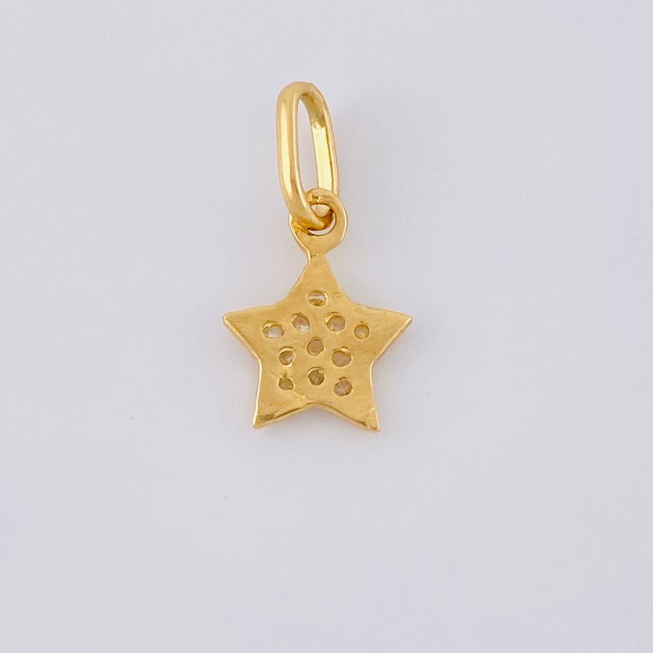 Dije Estrella 0.55 g / 1/2 in Oro Amarillo 18K