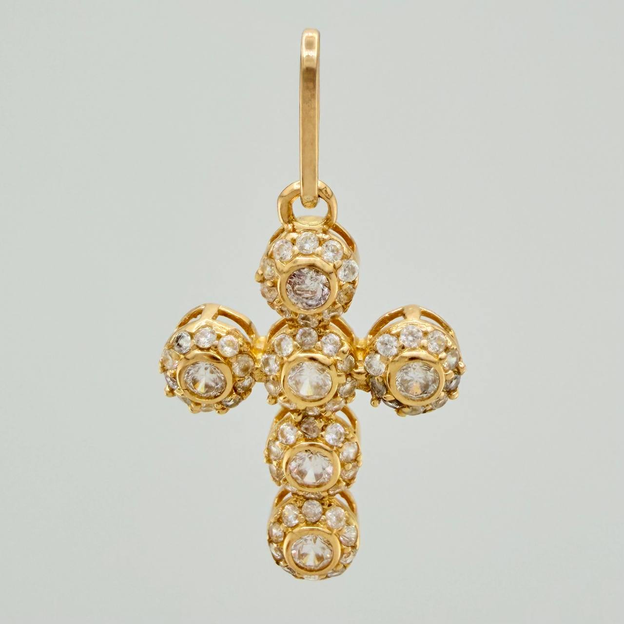 Dije Cruz Tupida 1.45gr / 1 in / Oro Amarillo 18K $