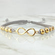 Gray Bracelet Charm Infinity 2.1gr / 18K Yellow Gold ©