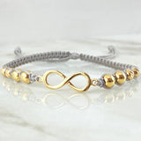 Gray Bracelet Charm Infinity 2.1gr / 18K Yellow Gold ©