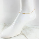 Tobillera Aro Seguido Estrella 2.1gr / 24cm-25cm / 1.4mm Bolas Lisas 3mm Oro Amarillo +4 18K