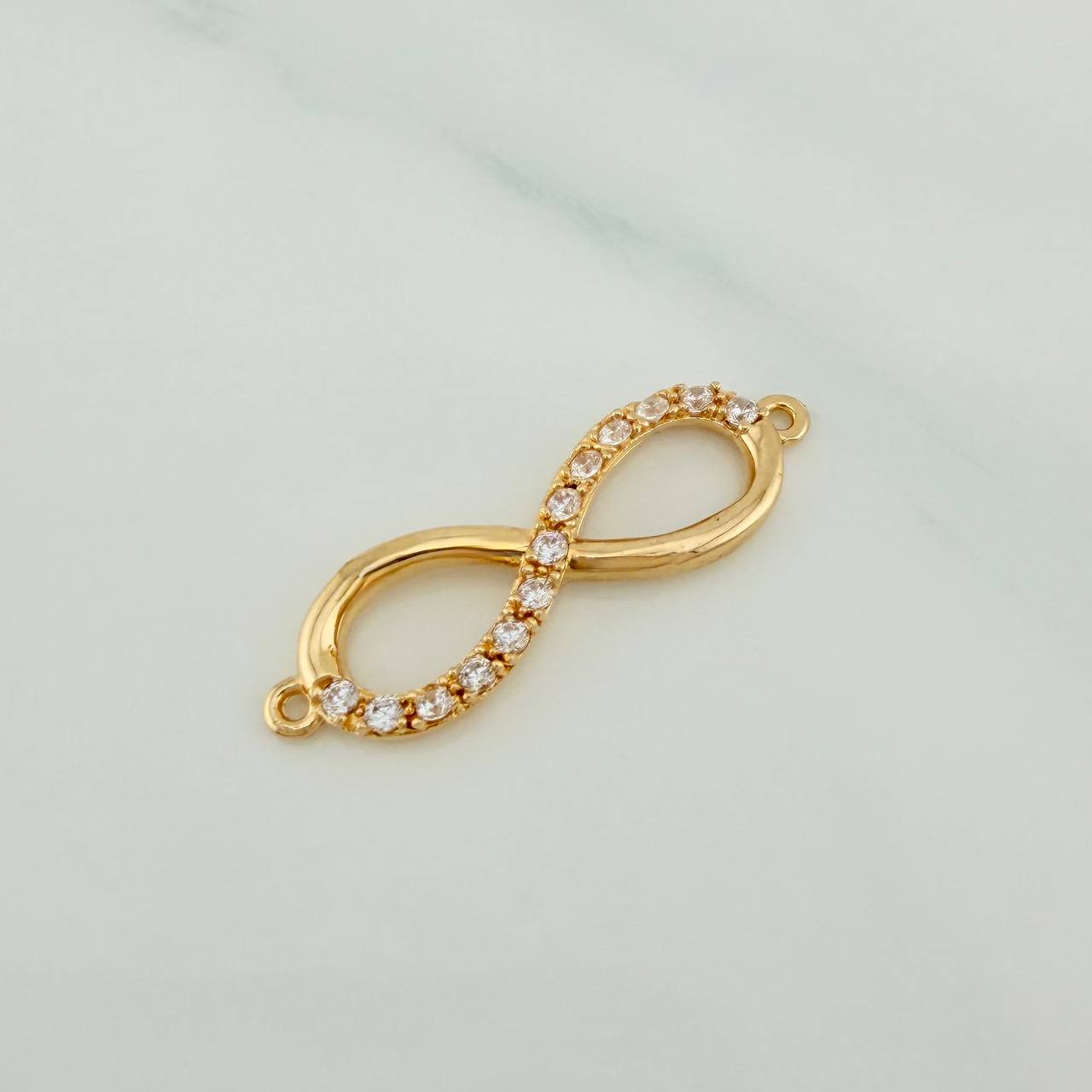 Herraje Infinito 1.55gr / 1 in / Oro Amarillo 18K &