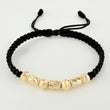 Pulsera Negra Cilindros Interceptos 7und / 4mm-5mm Oro Amarillo 18K  (A.C)
