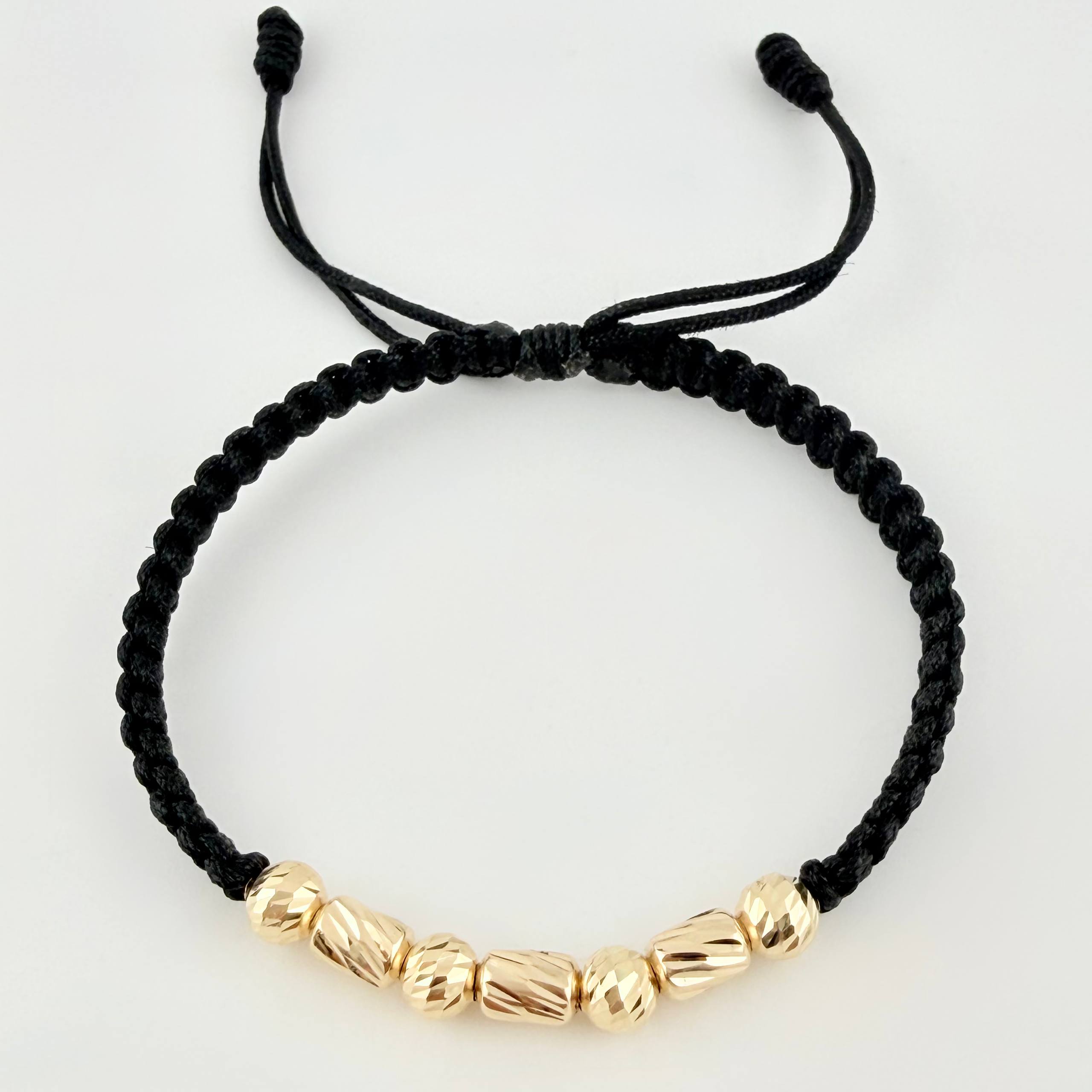 Pulsera Negra Cilindros Interceptos 7und / 4mm-5mm Oro Amarillo 18K  (A.C)