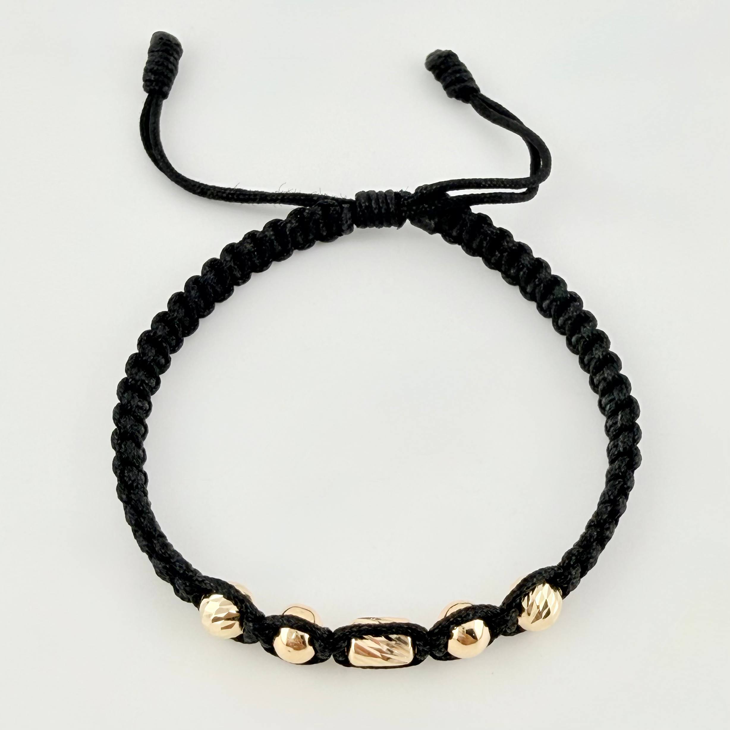 Pulsera Negra Cilindro Central 5und / 4mm-5mm Oro Amarillo 18K  (A.C)