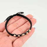 Pulsera Negra Cilindro Central 5und / 4mm-5mm Oro Amarillo 18K  (A.C)