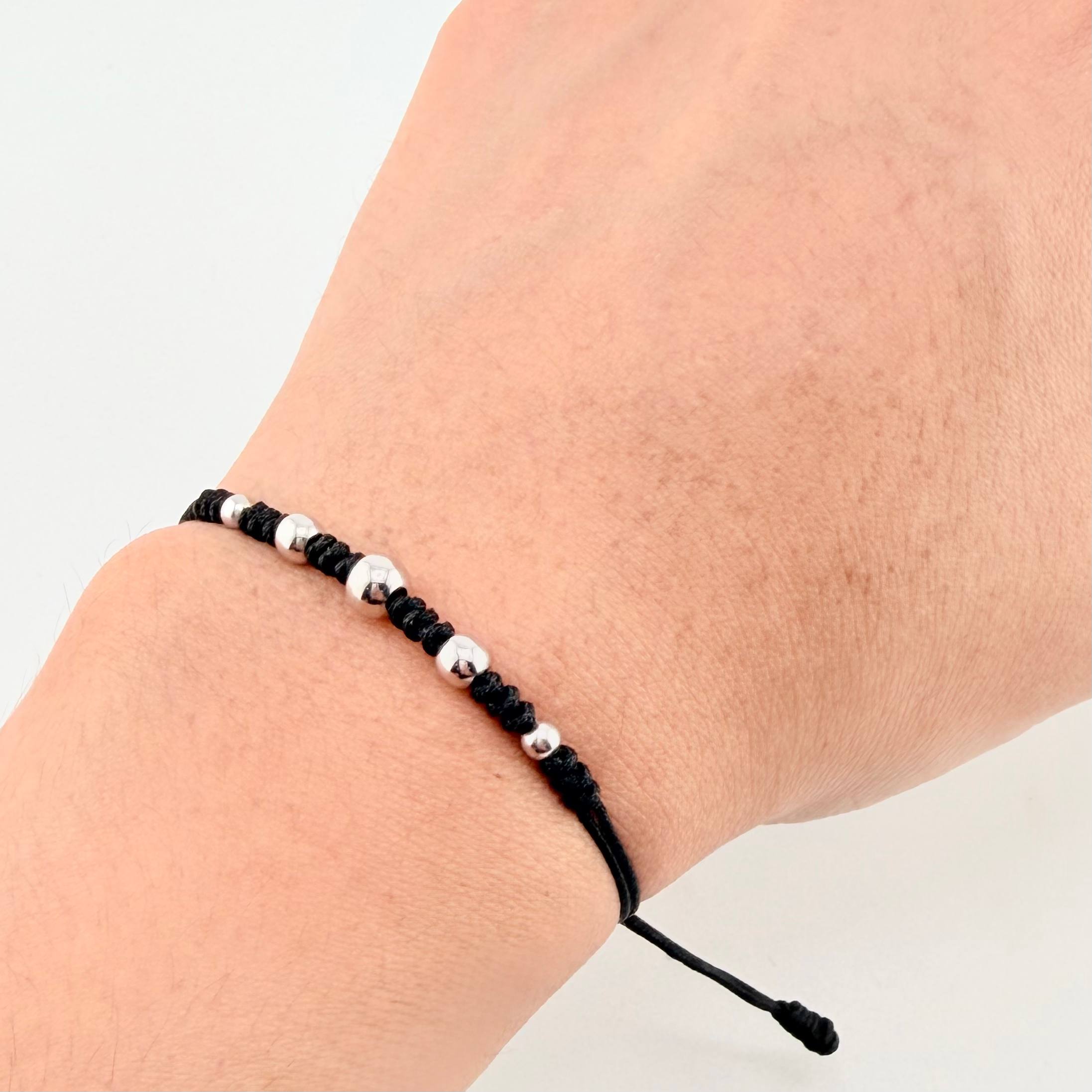 Pulsera Negra Secuencia Lisa 5und / 3mm-5mm Oro Blanco 18K  (A.C)