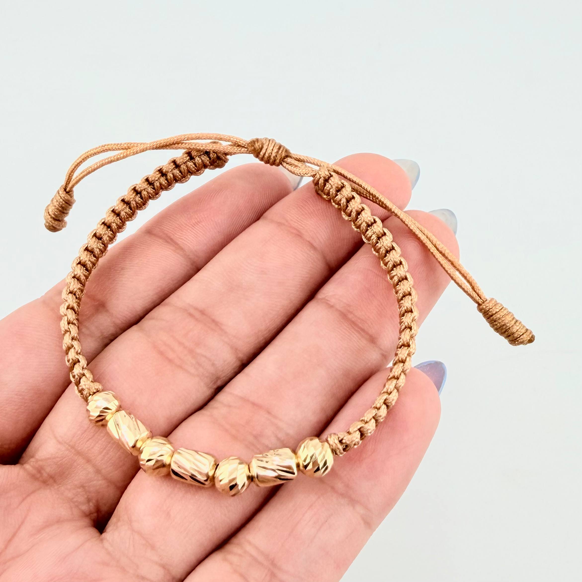 Pulsera Dorada Cilindros Interceptos 7und / 4mm-5mm Oro Amarillo 18K  (A.C)