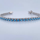 Pulso Tenis 16.85gr / 20.3cm / 4.7mm Circones Azules Oro Blanco 18K $