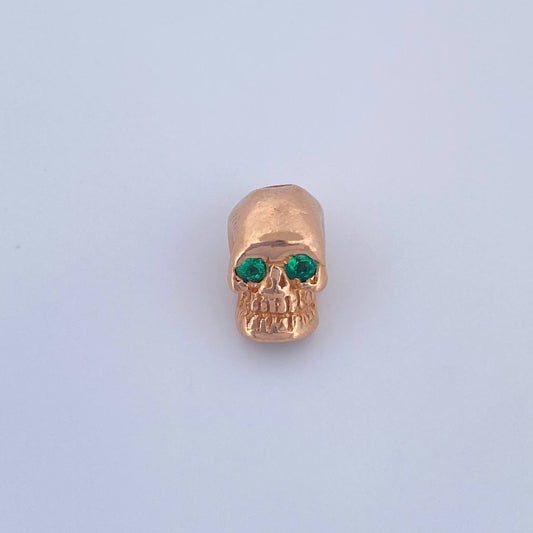Herraje Calavera 2.7gr / 1cm / Esmeralda 6pts Oro Rosa 18K (Joya) $