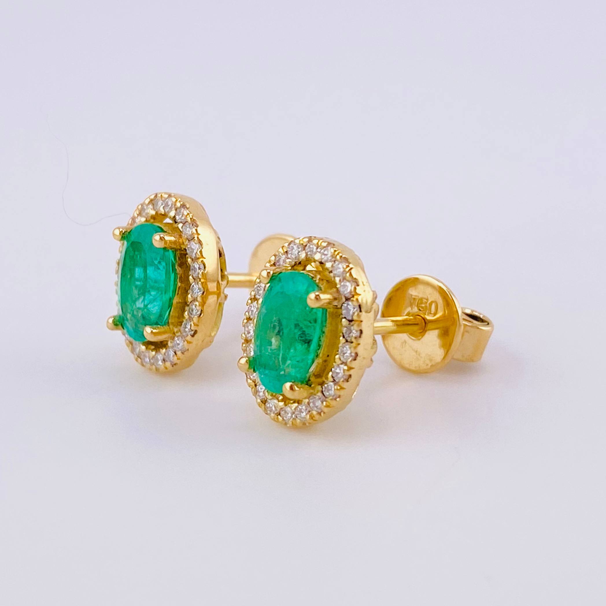 Stud Earrings Oval Halo Emeralds 1.12cts Diamonds 22pts 3.65g / in / 10.2mm Yellow Gold 18K