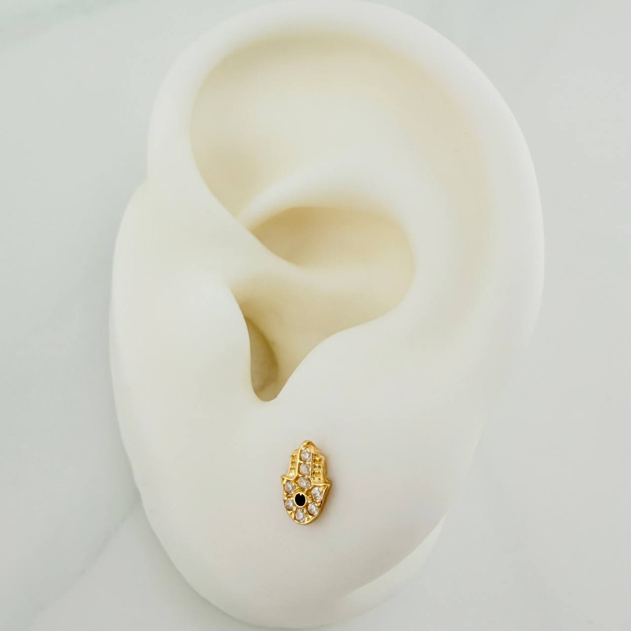 Topos Mano Hamsa 0.7gr / 4.2mm Oro Amarillo 18K %