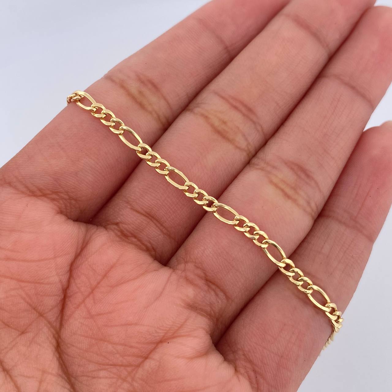 Figaro Bracelet 1.15gr / 7.7in / 18K Gold +1$