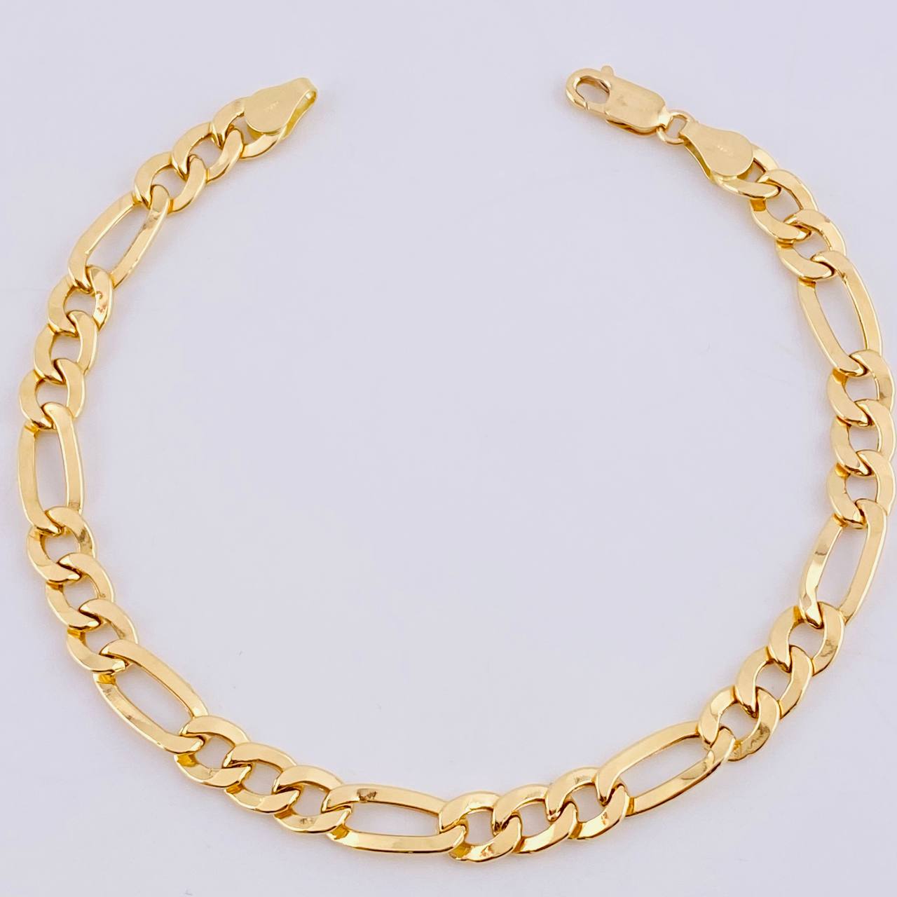 Pulso Figaro 6.1gr / 8 3/4 in / 6.4mm Oro Amarillo +1 18K *