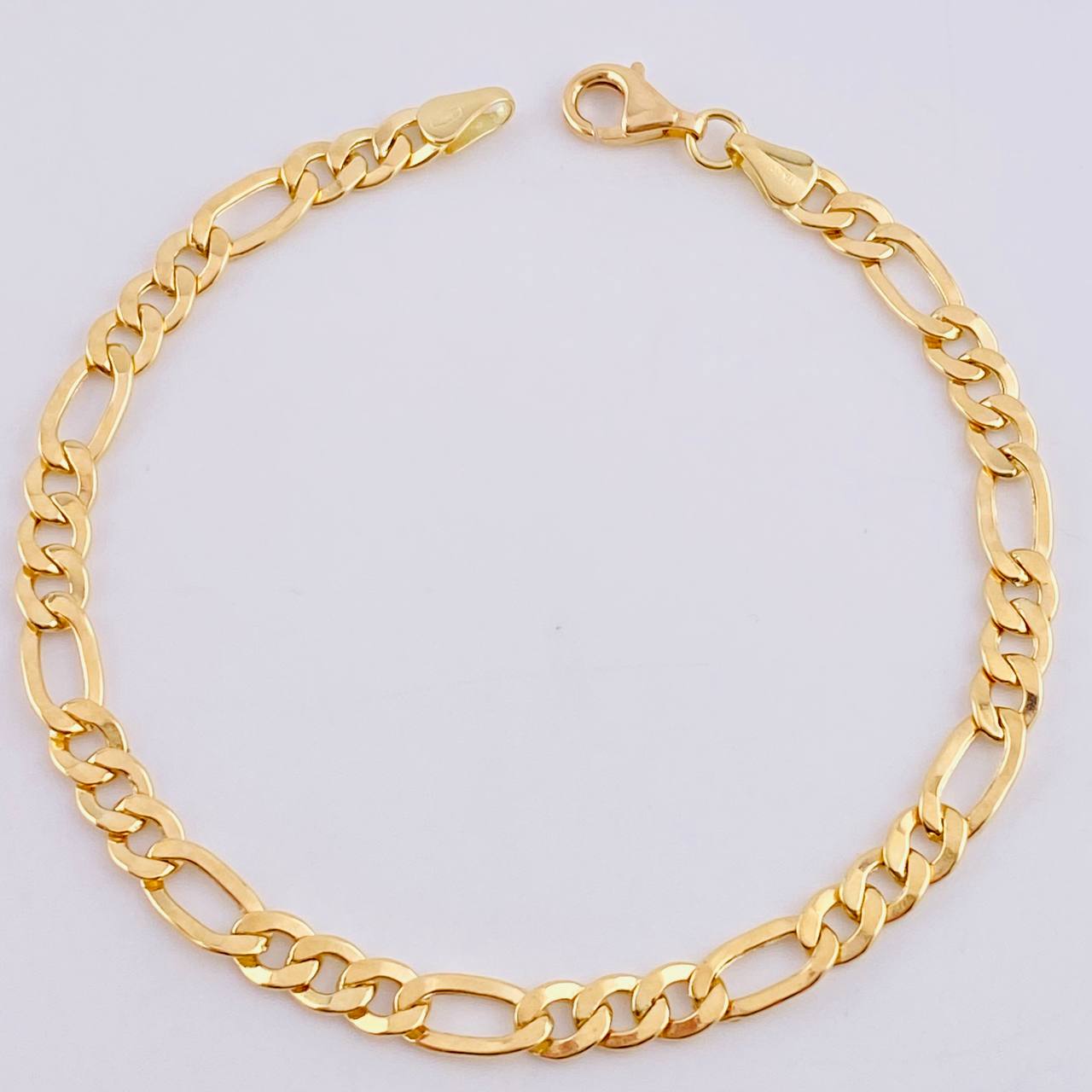 Pulso Figaro 4.7gr / 7 3/4 in / 5.2mm Oro Amarillo +1 18K