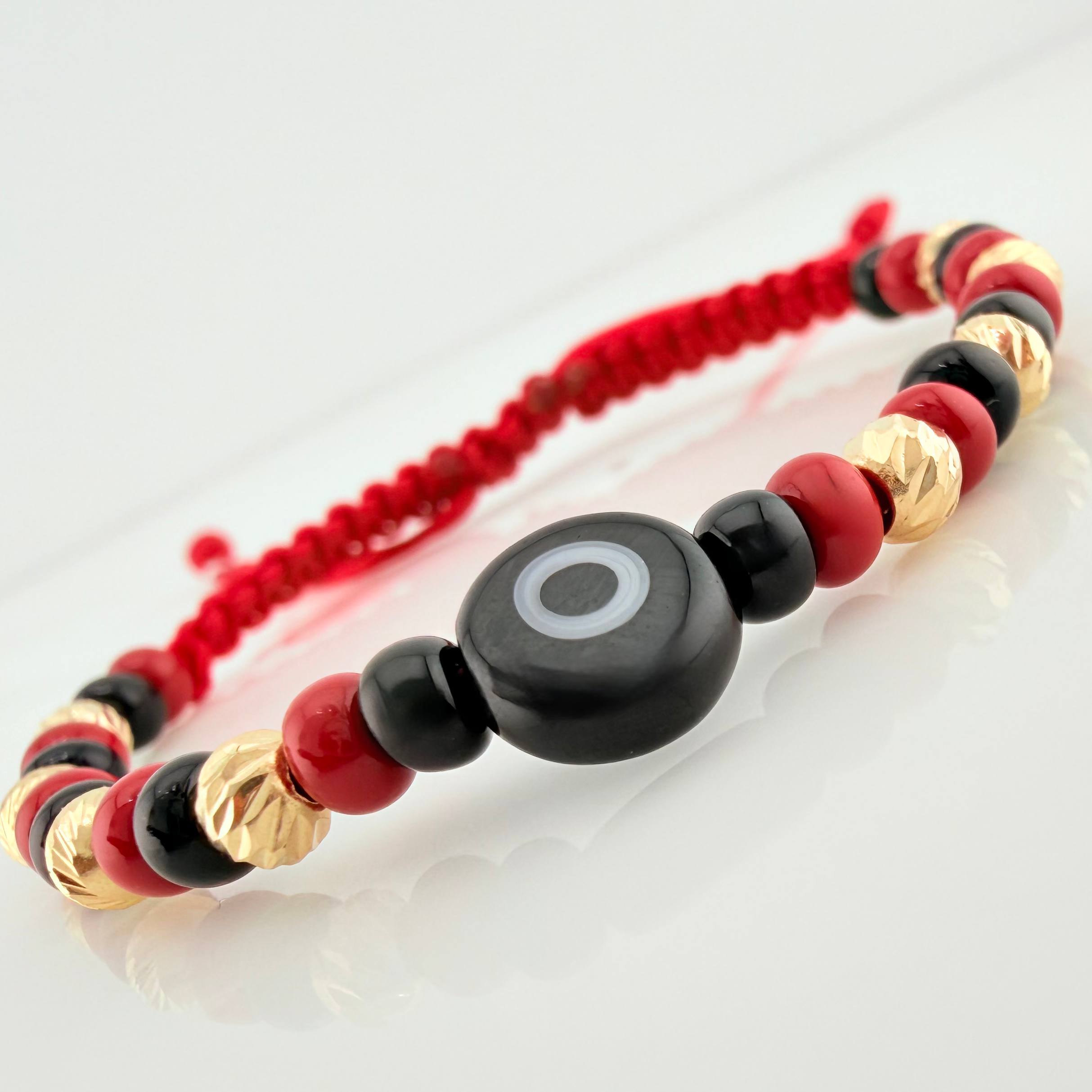 Red Woven Bracelet with Turkish Eye in 18K Yellow Gold