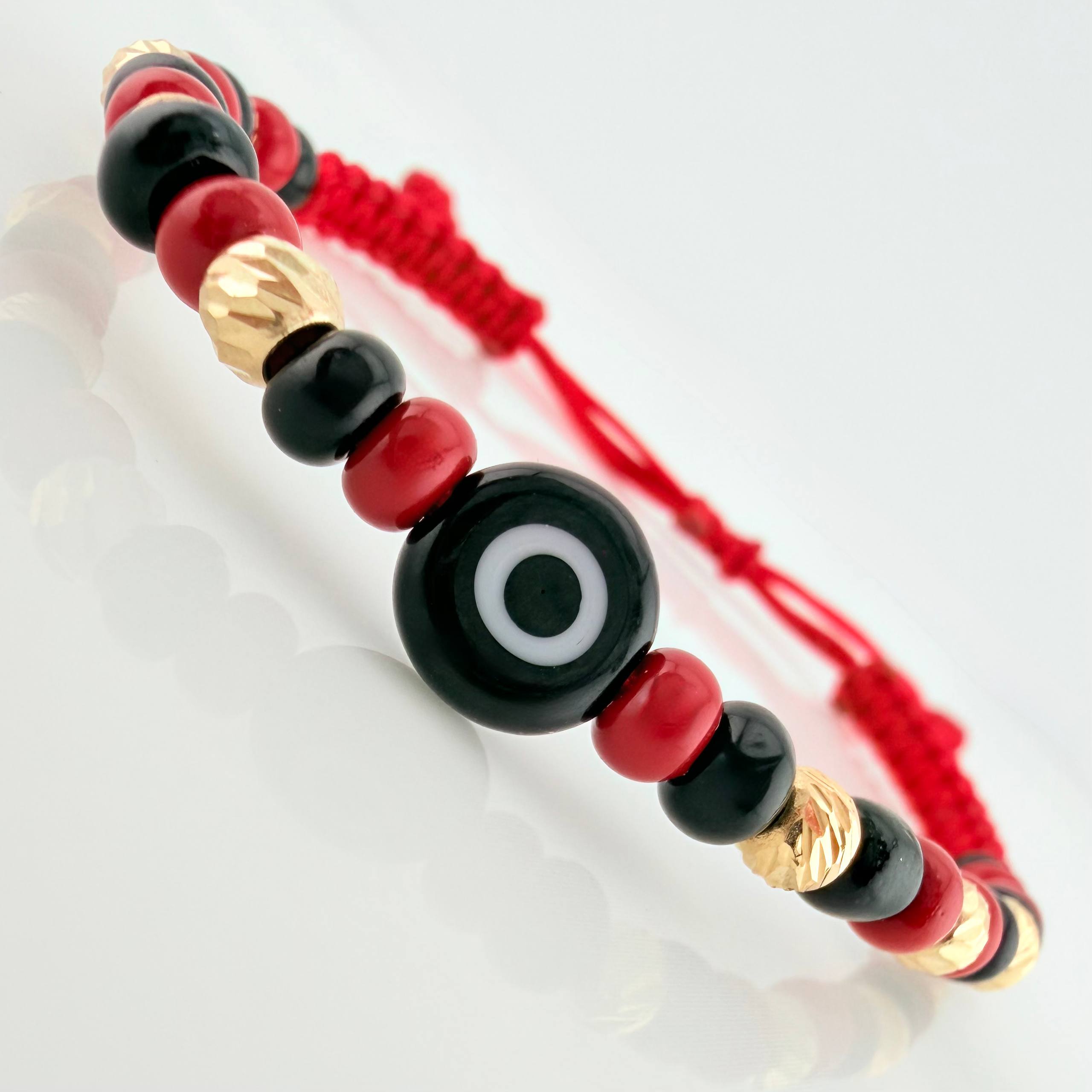 Red Woven Bracelet with Turkish Eye in 18K Yellow Gold