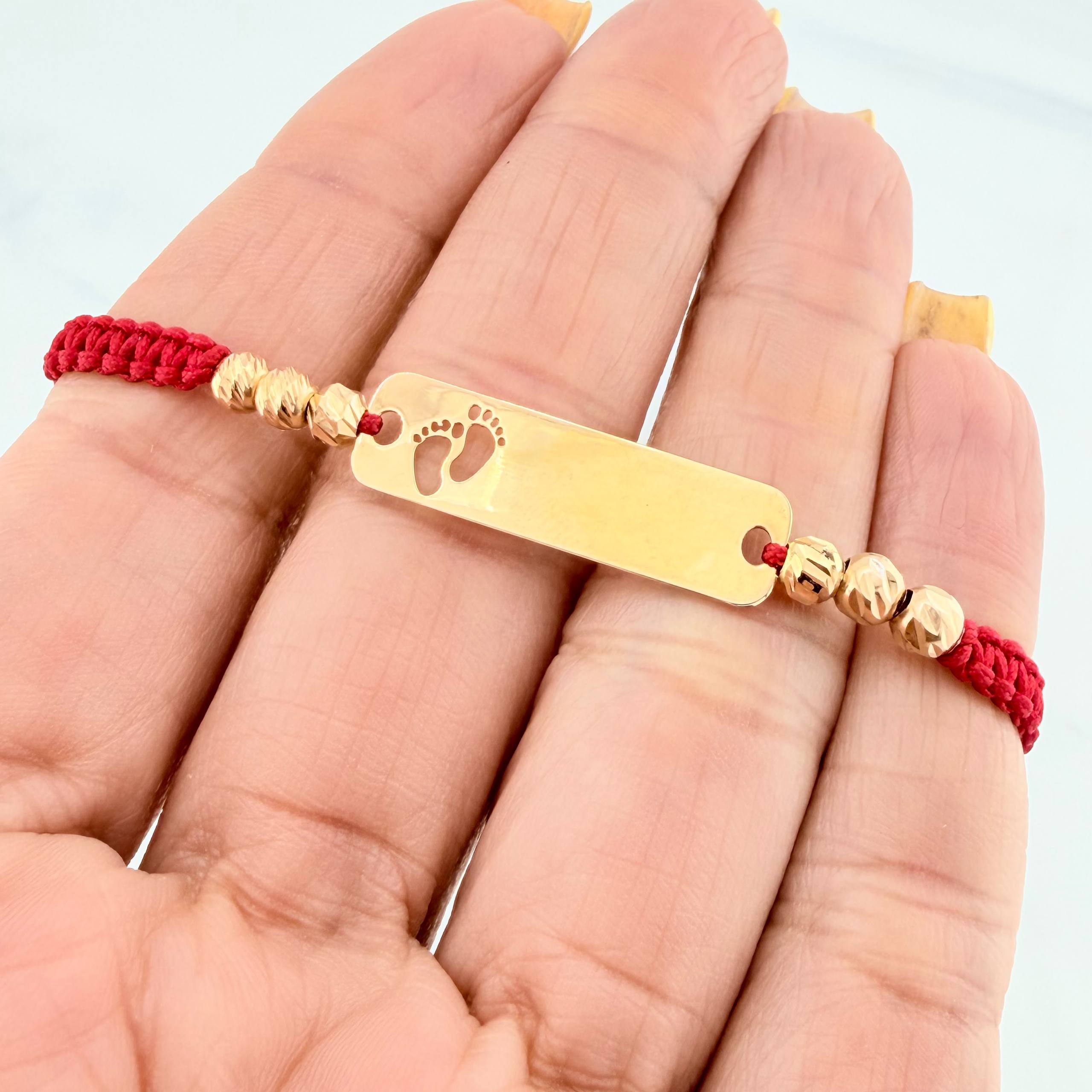 Red Woven Bracelet with Paw Print Plate in 18K Yellow Gold