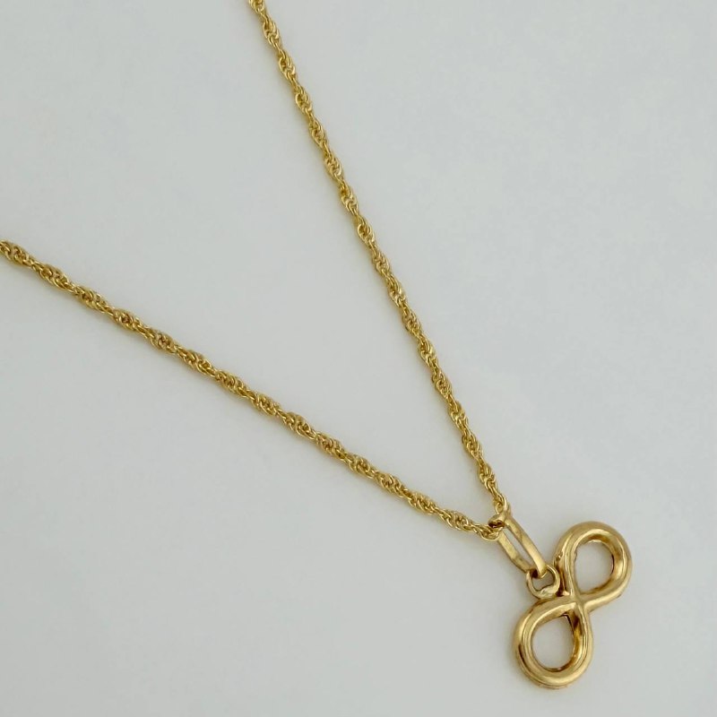 Set Cadena Lazo + Dije Infinito / 1,35 gr / 18 in Oro Amarillo 18K