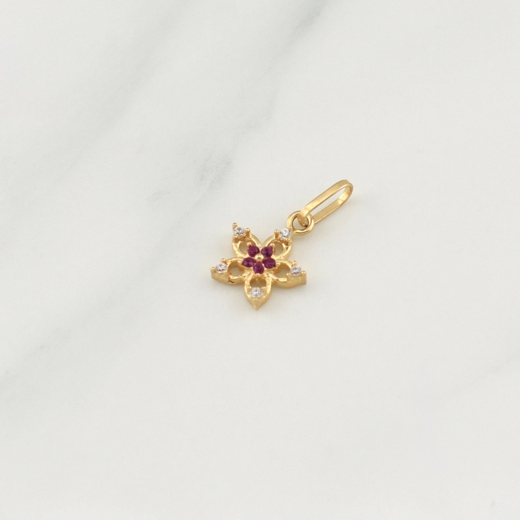 Dije Flor 0.5gr / 1/2 in / Oro Amarillo 18K !