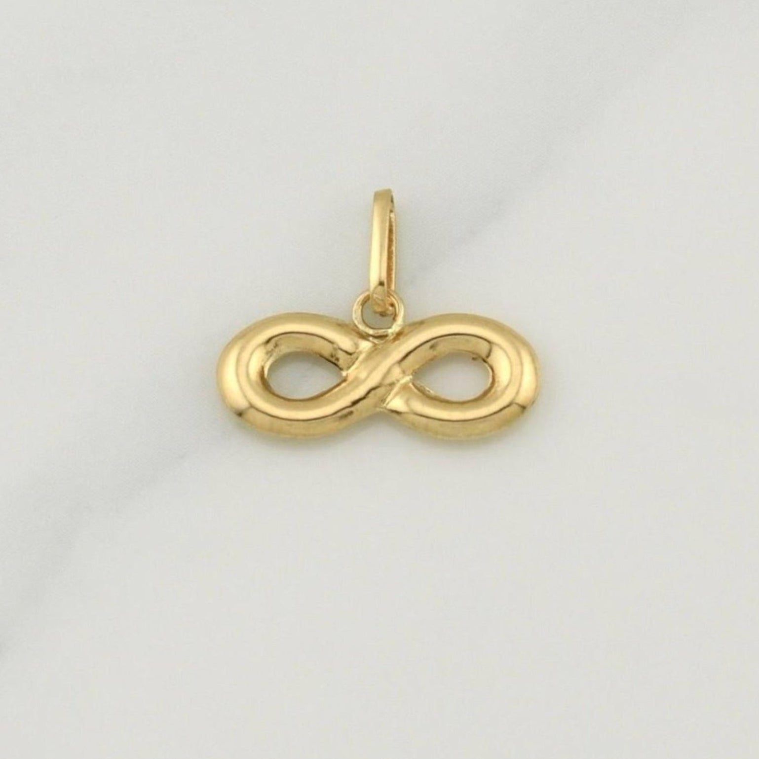 Dije Infinito 0.75 g / 1/2 in Oro Amarillo 18K