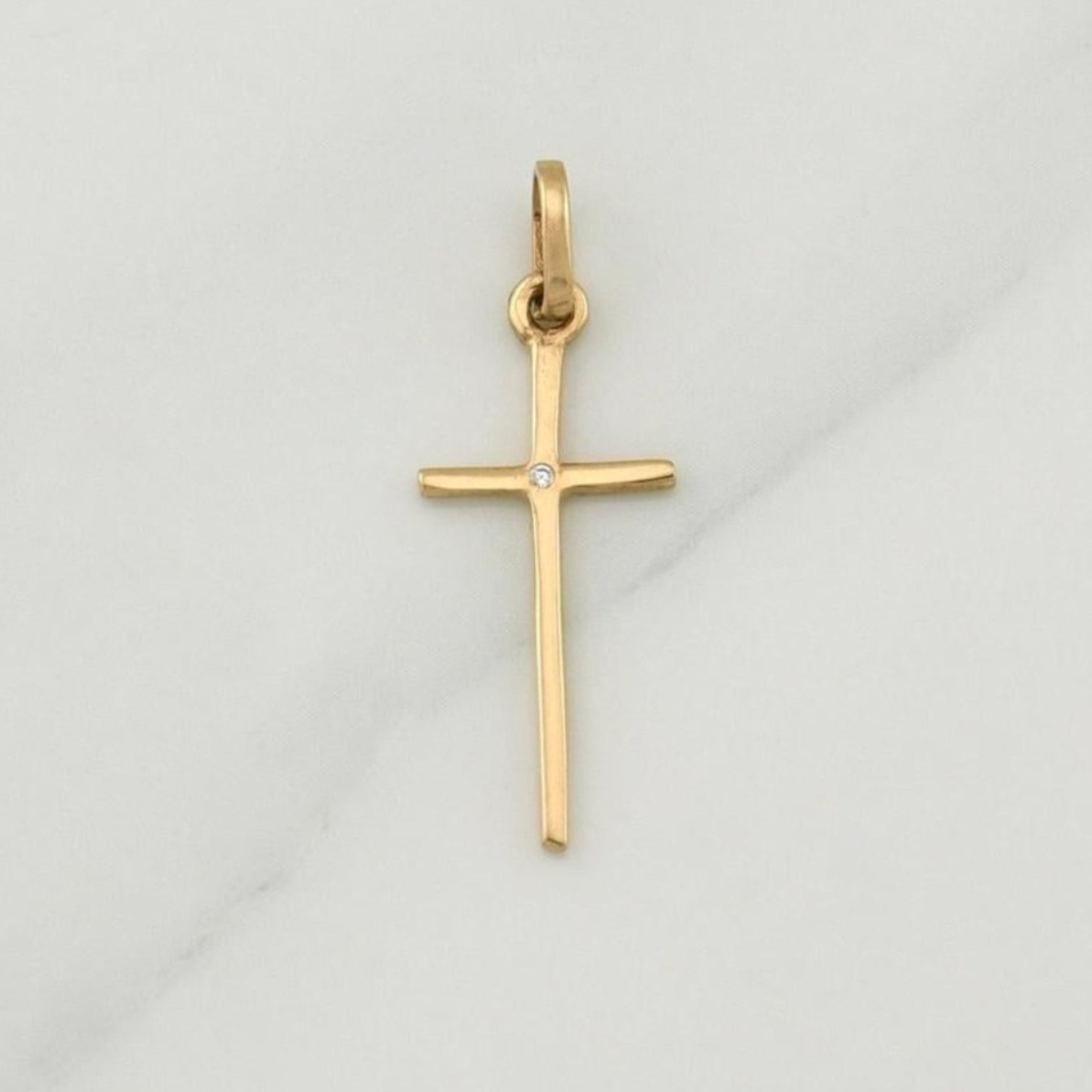 Dije Cruz 0.7 g / 1 in Oro Amarillo 18K