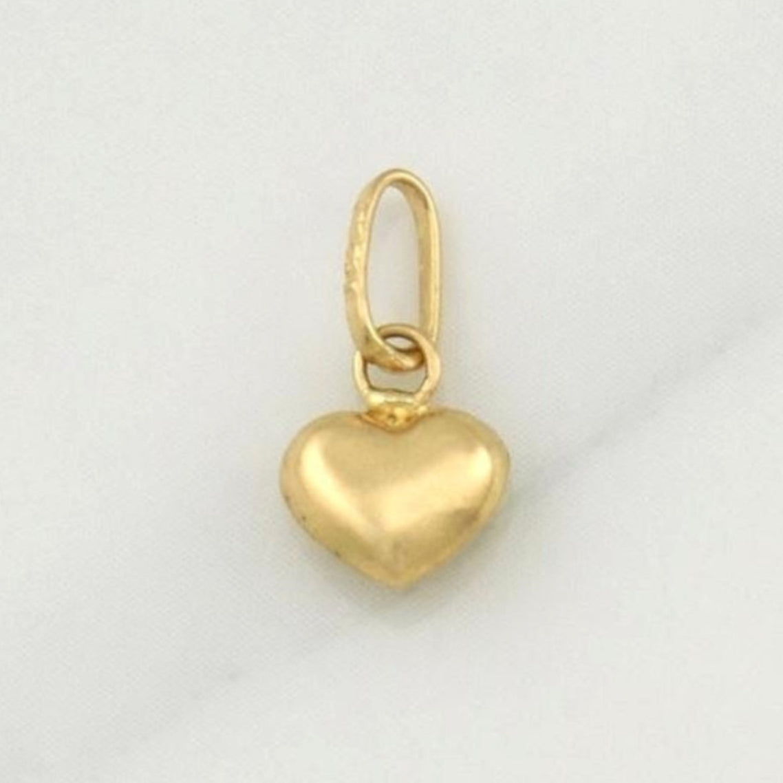 Dije Corazon 0.2 g / 1/2 in Oro Amarillo 18K