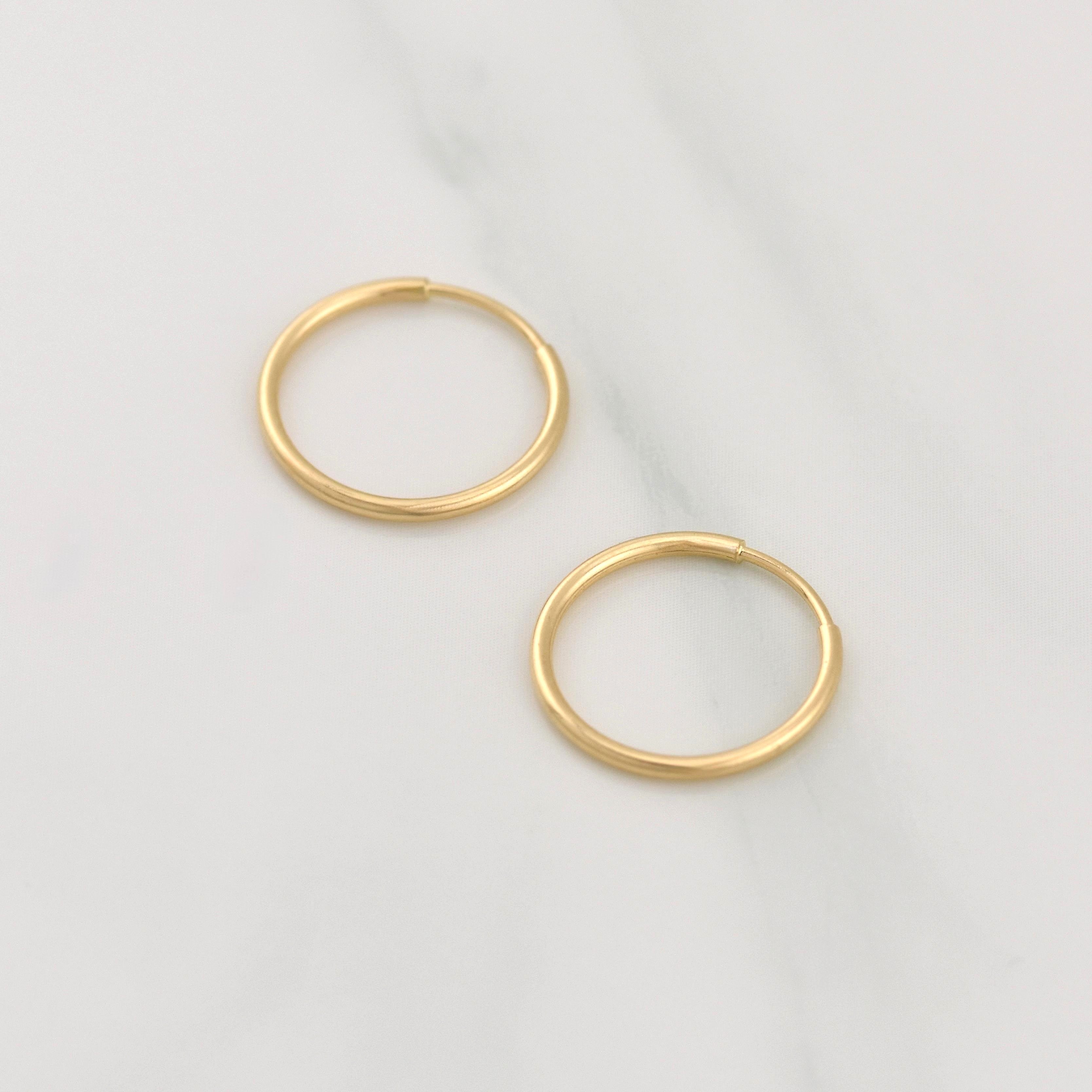Candongas Aro Liso 0.4g / 1/2 in Oro Amarillo 18K