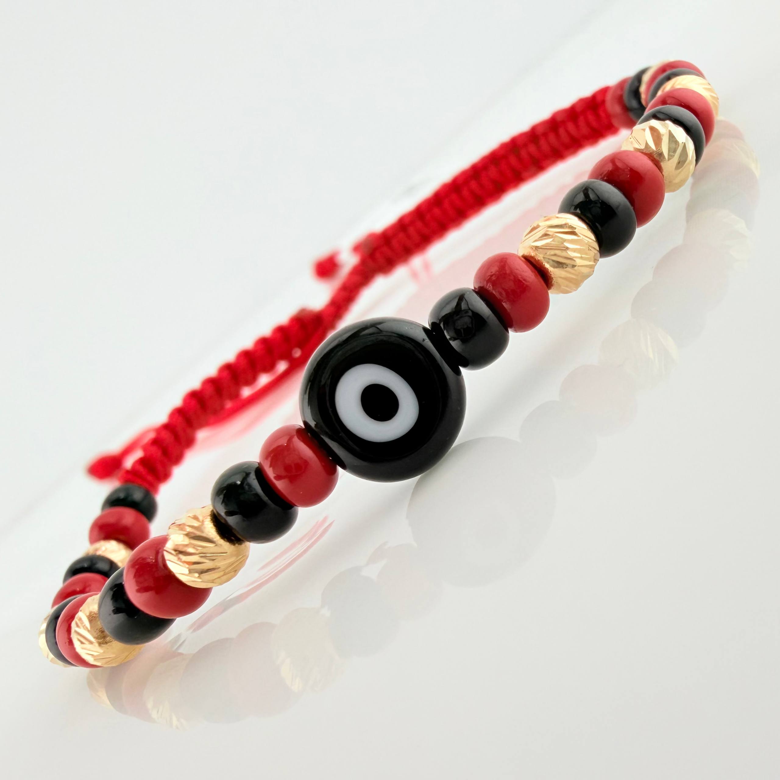 Red Woven Bracelet with Turkish Eye in 18K Yellow Gold