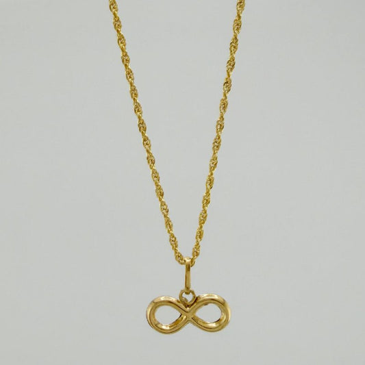 Set Cadena Lazo + Dije Infinito / 1,35 gr / 18 in Oro Amarillo 18K