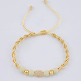 Pulsera Tejida Beige Herraje GC Bolas Lisas Oro Amarillo 18K