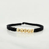 Pulsera Tejida Negra Bolas Diamantadas 4mm Oro Amarillo 18K