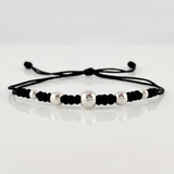 Pulsera Negra Secuencia Lisa 5und / 3mm-5mm Oro Blanco 18K  (A.C)