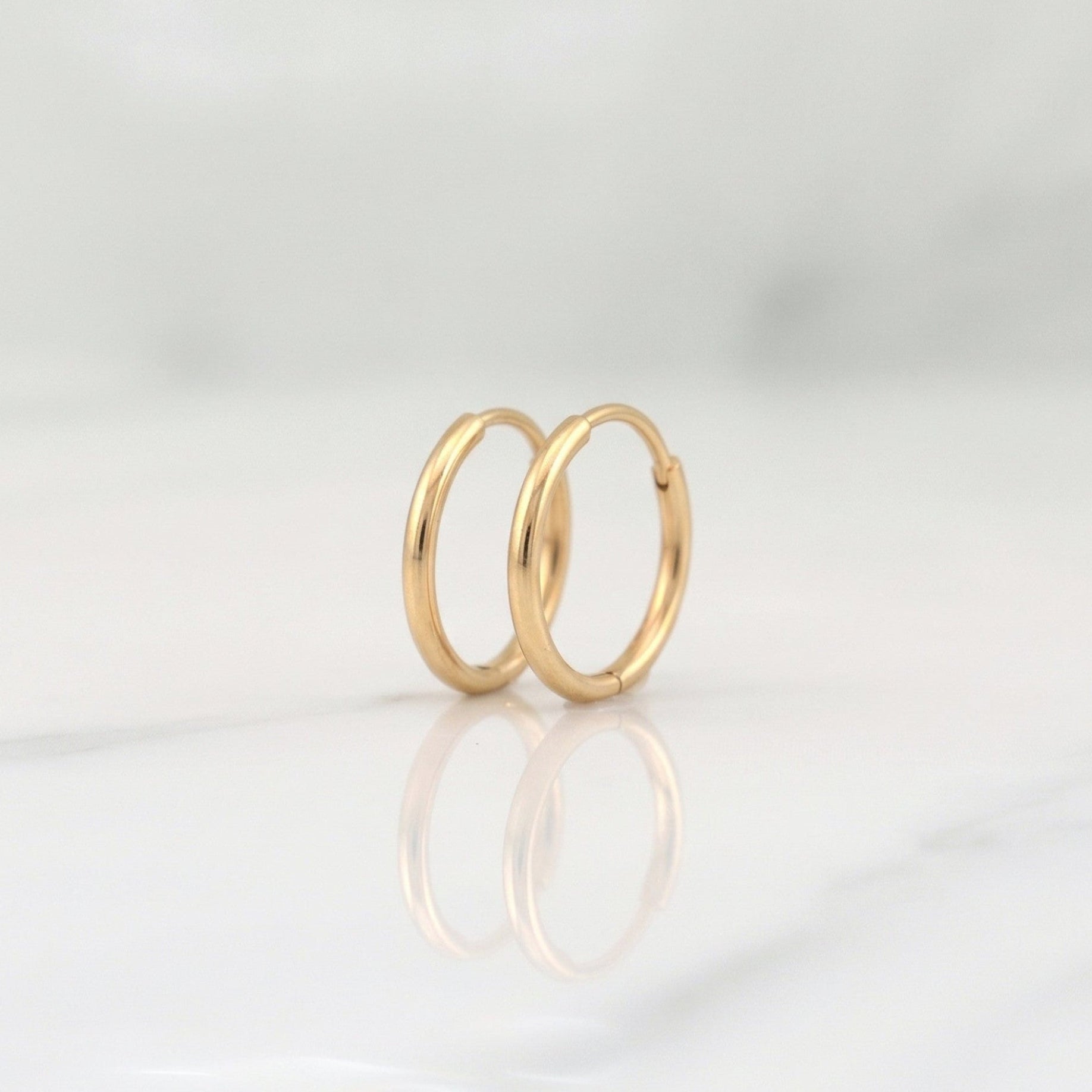 Candongas Aro Liso 0.3g / 1/4 in Oro Amarillo 18K